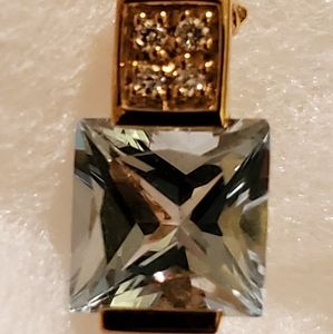 Blue Topaz and diamond gold pendant